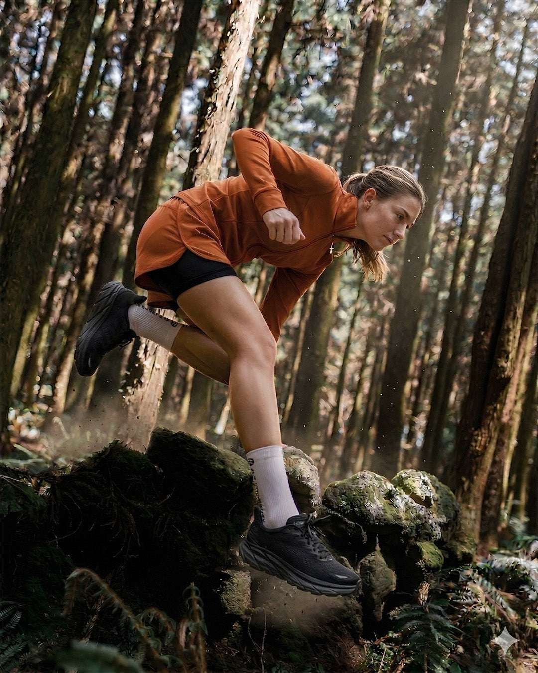 Person running through a forest on a trail