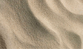 Close-up of sand with visible texture and patterns